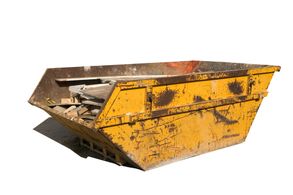 Yellow skip containing wood